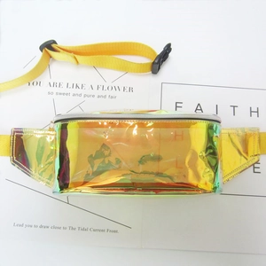 Detail of holographic golden laser waist bag featuring adjustable yellow strap and buckle