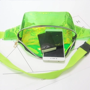 Detailed view of neon green holographic PVC fanny pack showing internal storage capacity