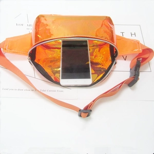 Holographic orange PVC waist bag showing interior storage capacity with a smartphone