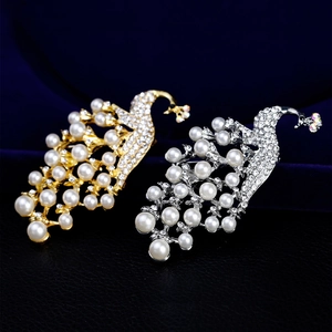 Exquisite 18k gold and silver peacock brooches with white pearls and sparkling crystals