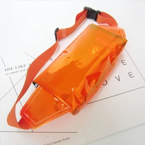Top view of orange transparent PVC waist bag with adjustable strap and black buckle
