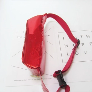 Close-up of red holographic laser waist bag with buckle strap and glossy finish