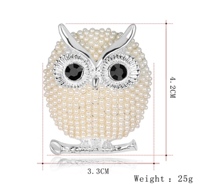 Detail view of owl brooch with pearls and dimensions 4.2CM by 3.3CM and weight 25g