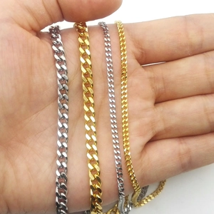 Detail of 3mm stainless steel Cuban chains in gold and silver finishes showing texture