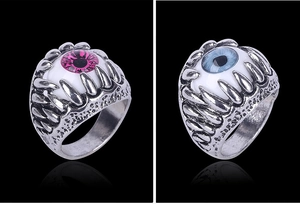 Gothic claw rings with pink and blue devil's eyes in silver alloy on black background