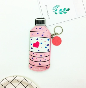Detail shot of the pink creative bottle-shaped coin purse with heart patterns and zipper