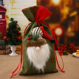 Linen Christmas drawstring gift bag with 3D Santa plush decor in festive red and green