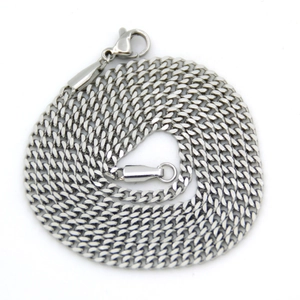 Detail of 3mm silver stainless steel Cuban chain with lobster clasp on white backdrop