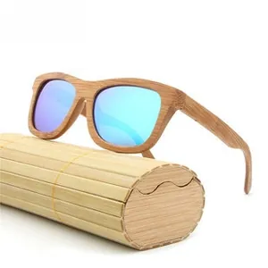 Close-up of bamboo sunglasses with blue reflective lenses and a cylindrical wooden case