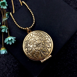 Vintage golden round floating locket necklace with floral engraving on beaded chain