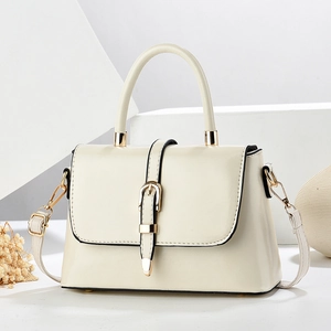 Elegant beige leather crossbody bag with gold hardware and top handle for women