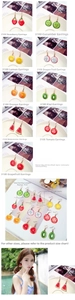 Detail view of assorted fruit drop earrings including strawberry and lemon styles