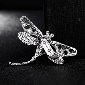 Fashionable shell dragonfly brooch in gunmetal finish with detailed textured wings