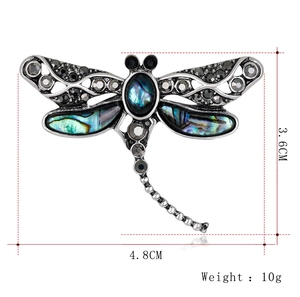 Detailed view of shell dragonfly brooch with size markings: 4.8cm width and 3.6cm height