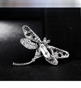 Detailed view of the vintage dragonfly brooch back with secure pin clasp closure