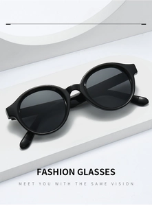 Detail of trendy oval black sunglasses showing high-quality frames and UV lenses
