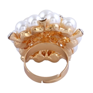Detail of adjustable gold pearl ring featuring white pearls and rhinestone accents