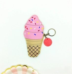 Close-up of cute ice cream coin purse with colorful sprinkles and metal zipper details