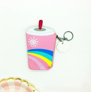 Close-up of pink drink-shaped coin purse with rainbow print and metal keychain hook