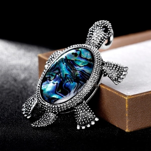 Retro turtle brooch with colorful abalone shell inlay and silver textured metal finish