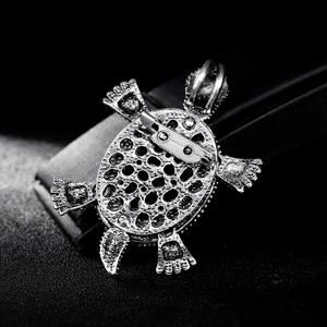 Retro turtle brooch in silver finish with shell texture shown from a detailed back view