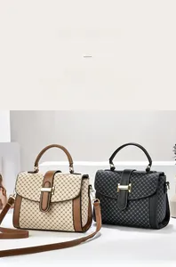 Detail of elegant handbags showing H-shaped gold metal buckles and crossbody straps
