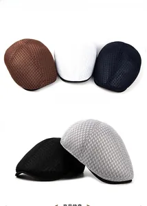 Flat lay of five breathable mesh berets in brown, white, navy, black and grey colors