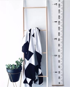 Detail of wooden growth chart measuring up to 150cm with canvas wall hanging decor