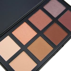 Close-up of 8-color matte and shimmer eyeshadow palette with square powder pans