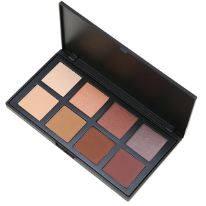 Close-up of an open 8-color eyeshadow palette with matte and shimmer neutral tones