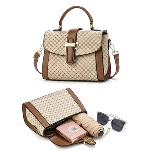 Crossbody bag interior detail showing capacity for phone, umbrella, and sunglasses