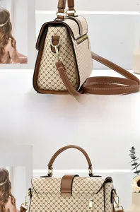 Rear view of large plaid tote bag showing back zipper pocket and brown leather straps
