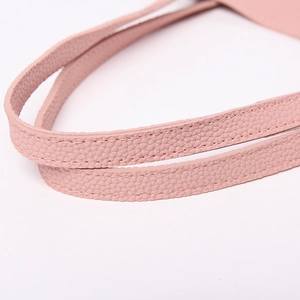 Macro shot of durable pink lychee pattern leather straps with reinforced stitching detail