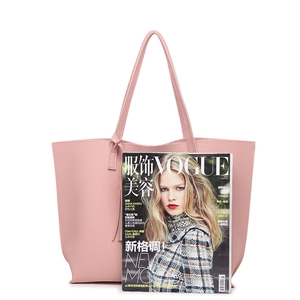 Large pink pebble texture tote bag shown next to a magazine for size reference