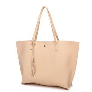 Detail view of beige lychee pattern tote bag featuring stylish tassel and magnetic closure