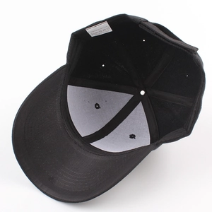 Internal view of black polyester baseball cap showing stitching and care label