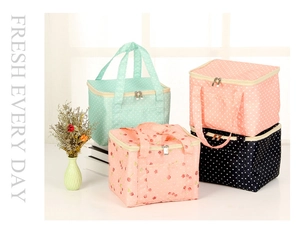 Detail view of colorful Oxford fabric lunch bags with various polka dots and patterns