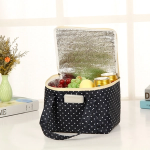 Navy blue polka dot insulated lunch bag with aluminum foil lining and large capacity