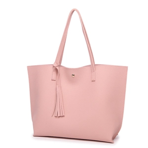 Detail view of pink litchi grain PU leather tote bag with tassel and magnetic closure