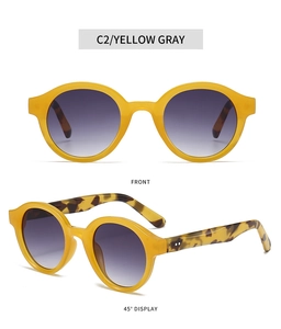 Front and 45-degree angle views of vintage oval yellow resin sunglasses with tortoiseshell arms
