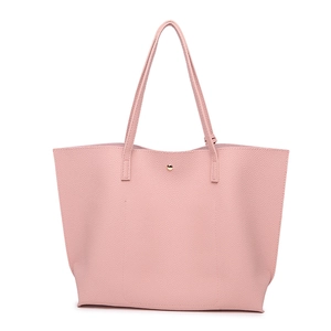 Close-up of pink litchi grain faux leather texture and magnetic snap on large tote bag