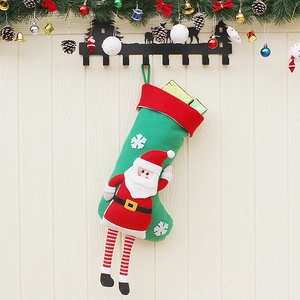 Festive Christmas stockings with 3D Santa and snowflakes hanging on a wooden wall background