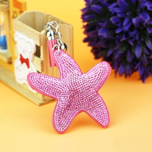 Sparkling pink rhinestone starfish keychain with leather tassel and silver clasp hardware