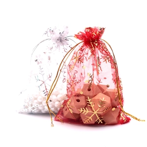 Organza drawstring gift bags with gold and silver snowflakes for Christmas favors
