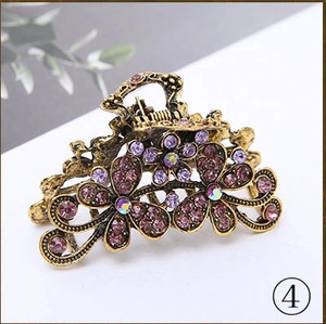 6cm vintage alloy hair claw clip with purple flower rhinestone design on white surface