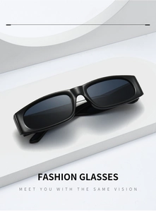 Close-up of minimalist black narrow rectangular sunglasses on a geometric white pedestal