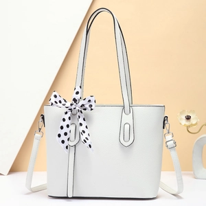 White litchi pattern leather tote bag with polka dot scarf and silver hardware