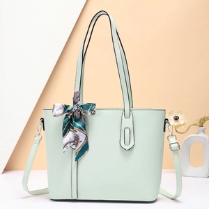 Mint green leather tote bag with decorative silk scarf and adjustable strap for women