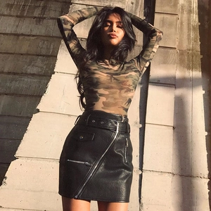 Women's camouflage long sleeve mesh top paired with black leather mini skirt street style