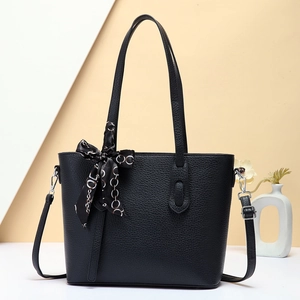 Chic black lychee leather tote bag with elegant scarf and adjustable shoulder strap